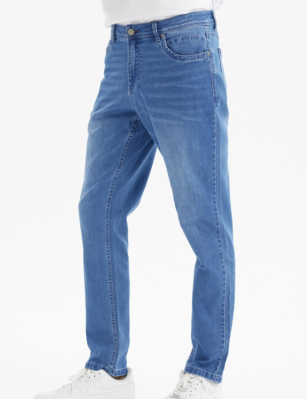 Jeans slim azul para hombre con diseño liso corte ajustado y efecto deslavado ligero en las piernas