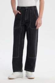 Jeans baggy negro con costuras visibles en contraste sin estampa corte suelto y cómodo ideal para estilo relajado