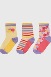 Calcetines niña tripack amarillo con diseños de rayas y estampados coloridos