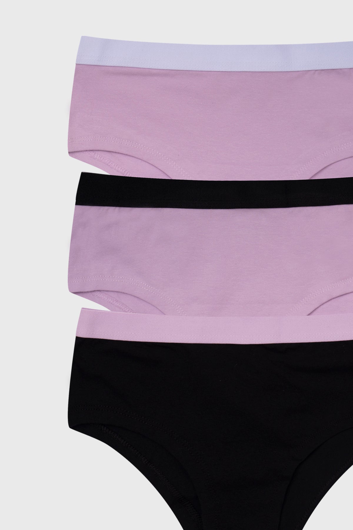 Pantaleta tripack palo rosa para niña con detalles de cintura elástica en negro y blanco