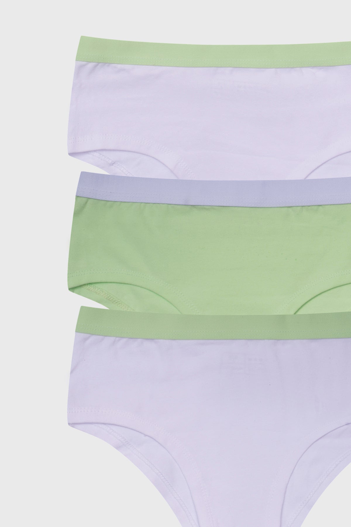 Pantaleta tripack para niña en verde claro y blanco con cinturas en tonos pastel