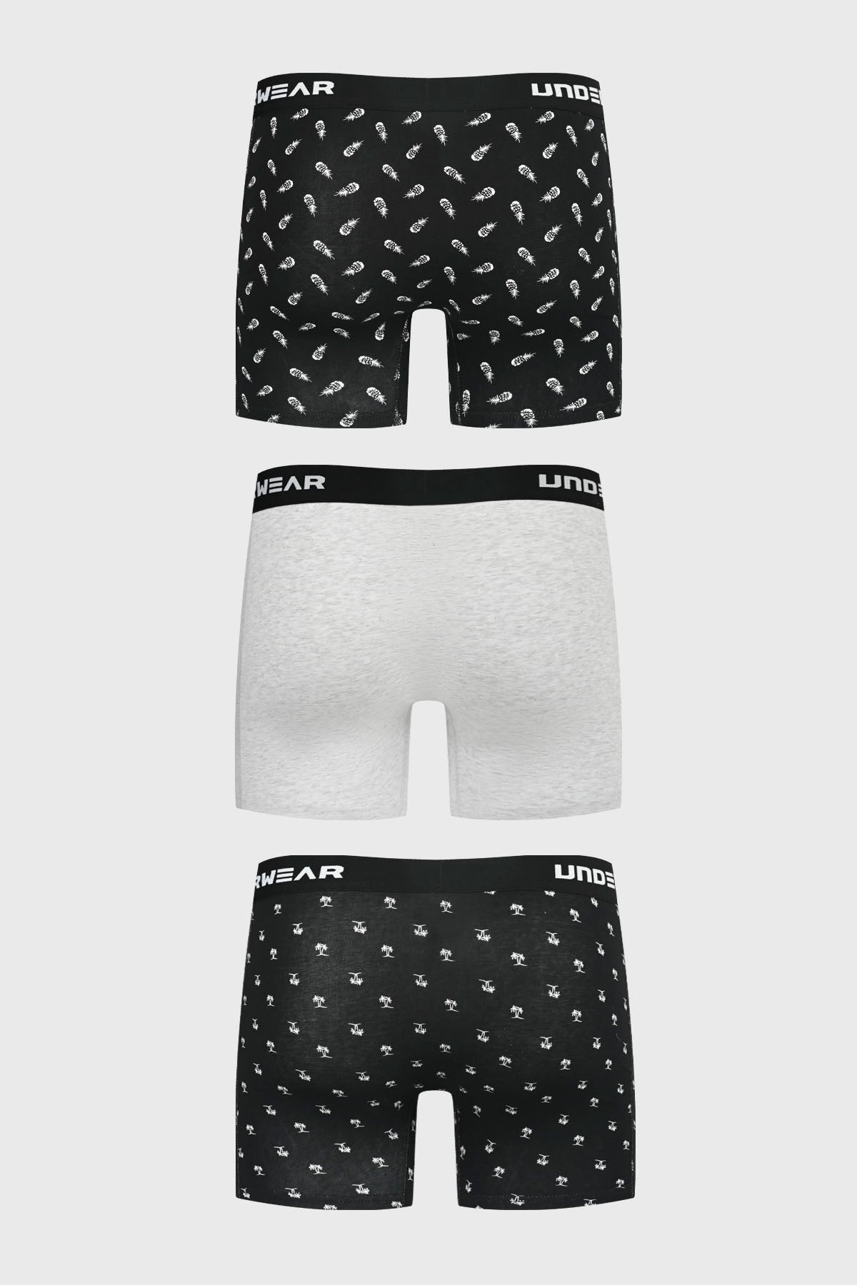 Boxer hombre tripack largo negro uno liso otro gris claro y uno con estampado de piñas pequeñas repetidas en blanco