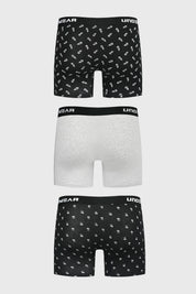 Boxer hombre tripack largo negro uno liso otro gris claro y uno con estampado de piñas pequeñas repetidas en blanco