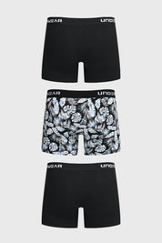 Boxer hombre tripack negro dos lisos y uno con estampado de hojas tropicales en blanco y azul con cinturilla elástica
