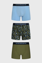 Boxer hombre tripack verde incluye uno liso azul claro uno estampado geométrico y uno liso verde todos con cinturilla negra