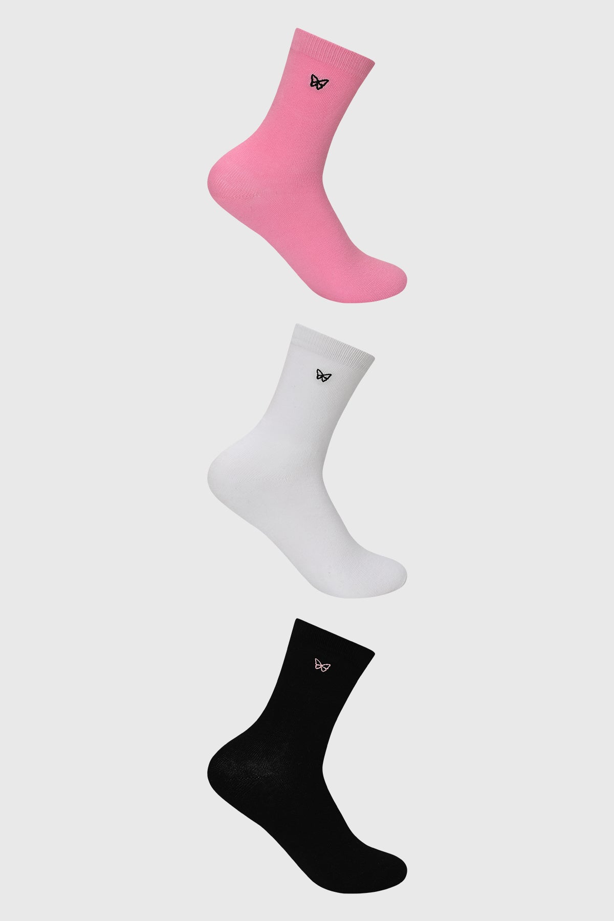 Calcetines mujer tripack rosado con diseño de mariposa negra pequeña en la parte superior estilo casual