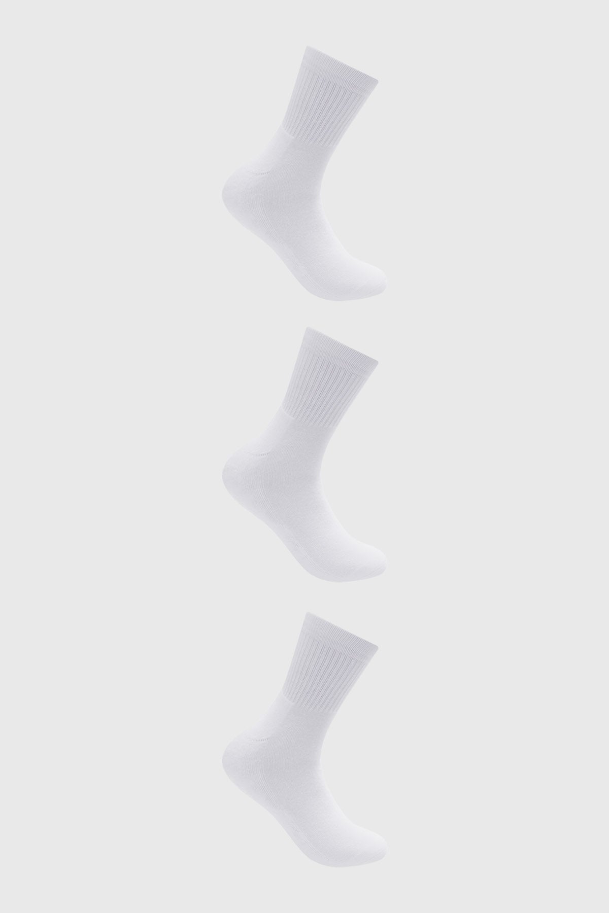 Calcetines unisex blancos lisos en tripack con diseño acanalado visible en la parte superior del puño