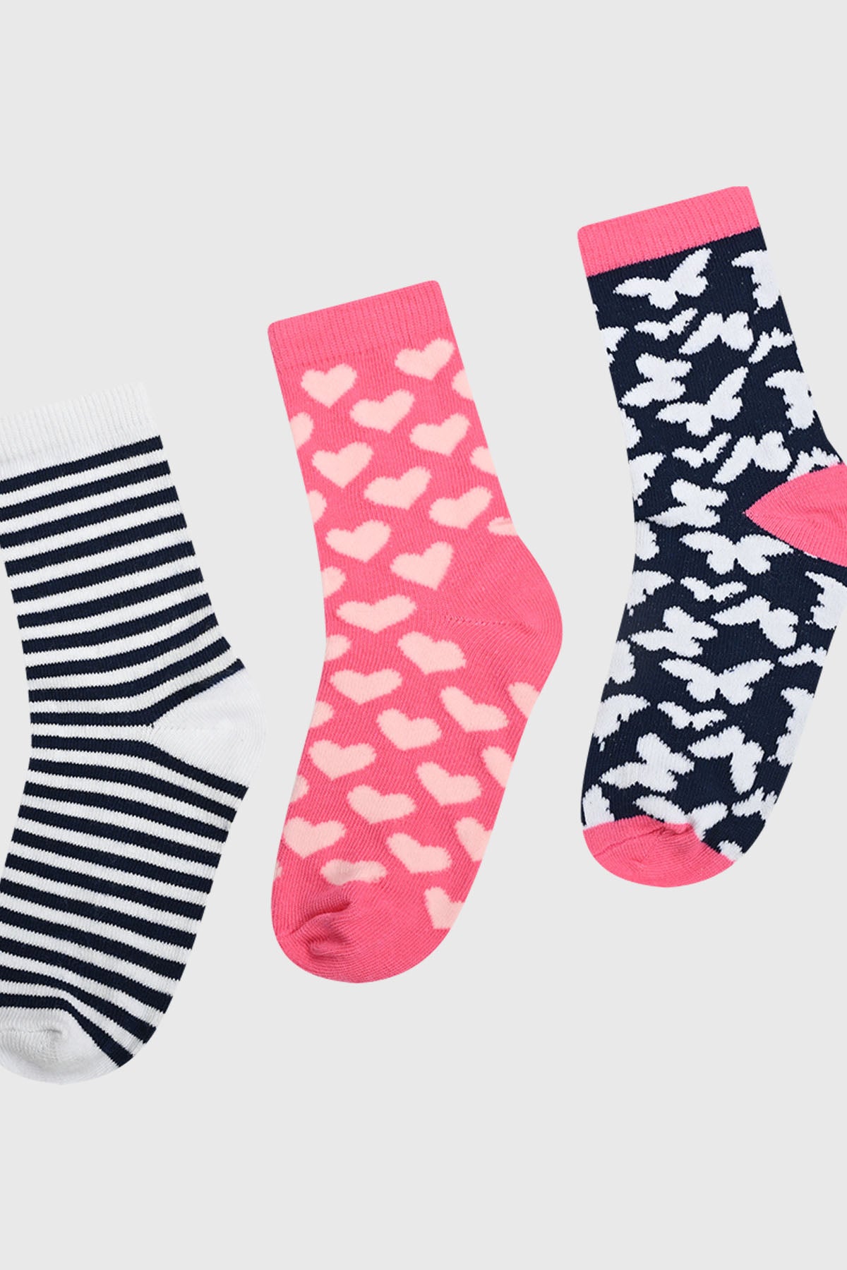 Calcetines niña tripack fucsia con corazones y rayas en estilo gráfico divertido y colorido