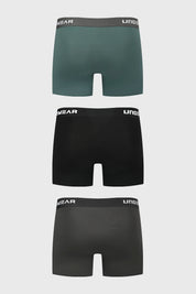 Boxer hombre tripack negro liso con cinturilla elástica con texto UNDERWEAR en blanco y corte ajustado moderno