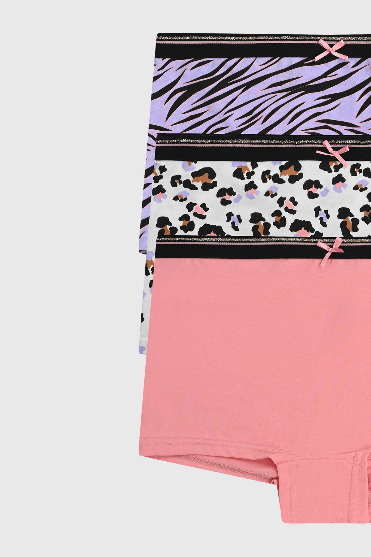 Calzón niña tripack rosado con diseños de cebra lila leopardo multicolor y liso rosa cada uno con lazo en la cintura
