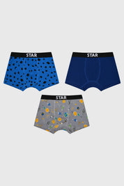 Boxer niño tripack azul con diseños de estrellas en negro y espacio en gris estilo cartoon