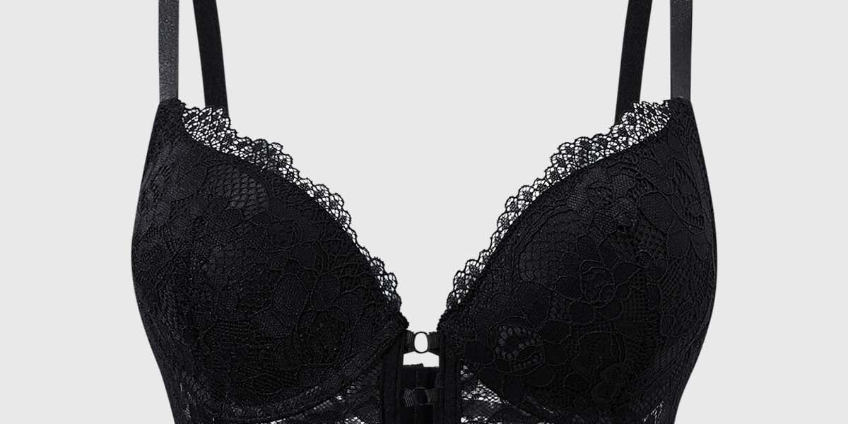 Sostén negro de encaje con cruce en el medio y detalles florales