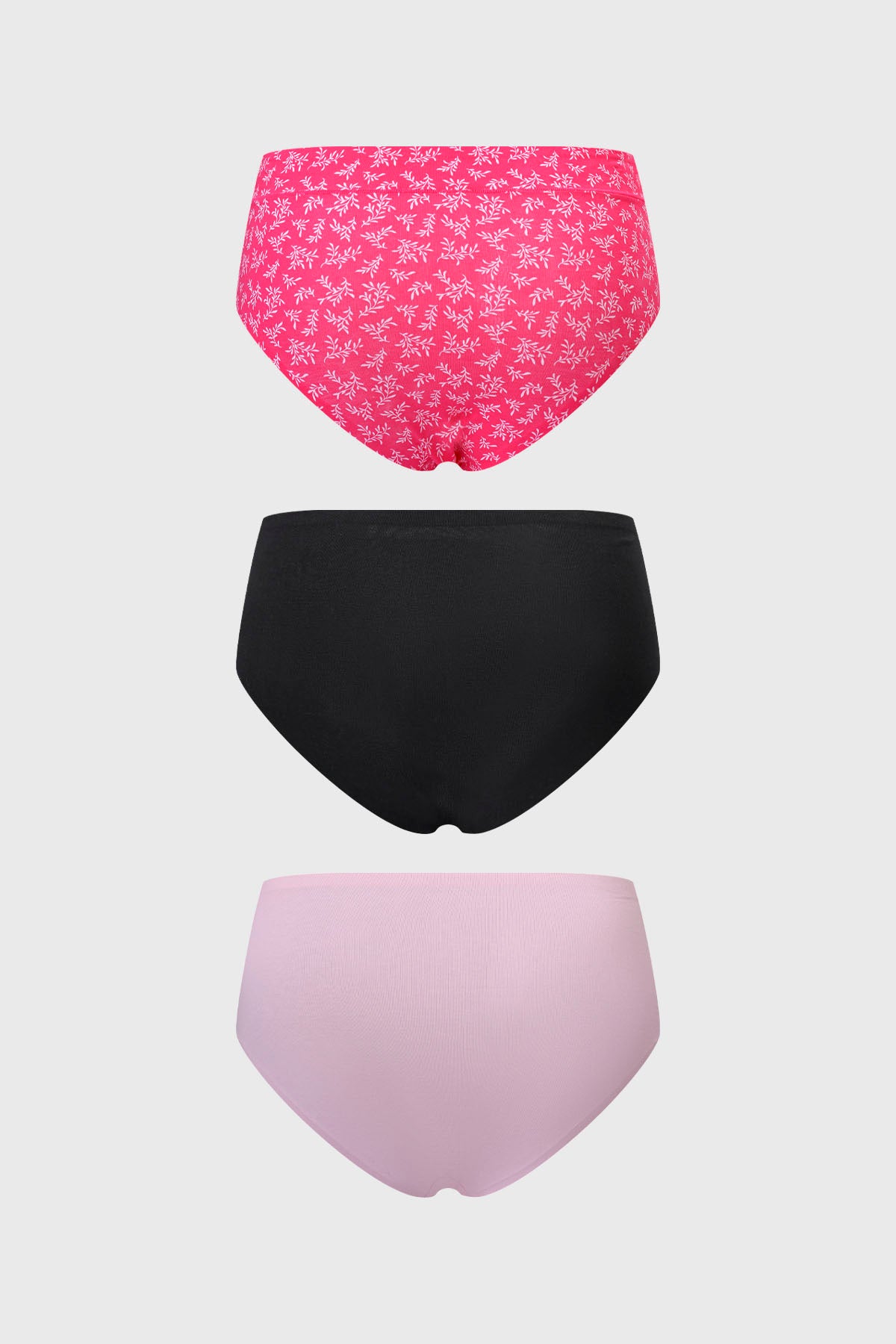 Calzón mujer tiro alto tripack fucsia con diseño floral en parte superior negro liso al medio y rosa liso en la parte inferior