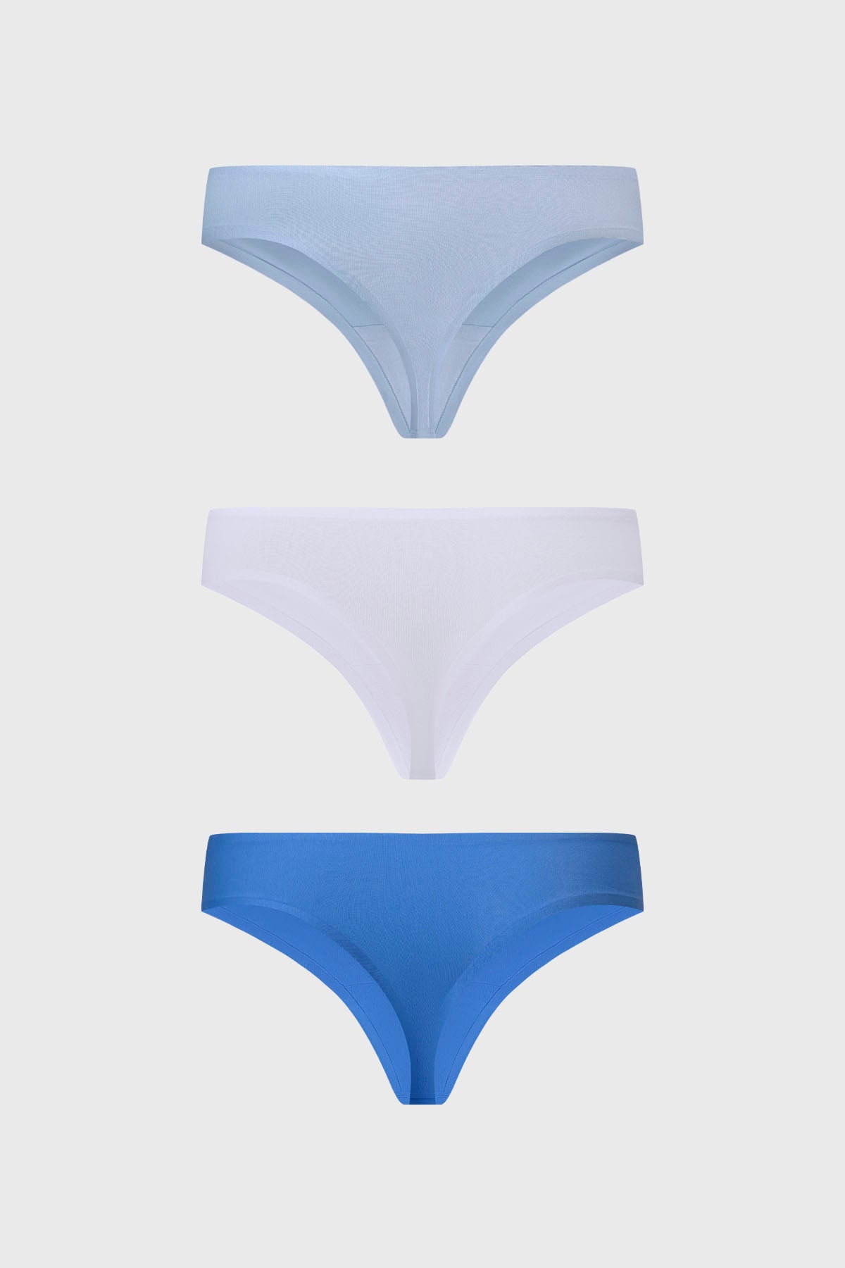 Tripack de calzones colaless para mujer en blanco azul claro y azul sin estampas diseño liso y minimalista