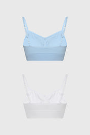 Bipack de sostenes peto liso azul claro y blanco sin estampas con tirantes delgados para mujer