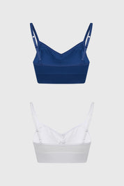 Bipack de sostenes peto para mujer en azul marino y blanco diseño liso con tirantes delgados y detalle fruncido central