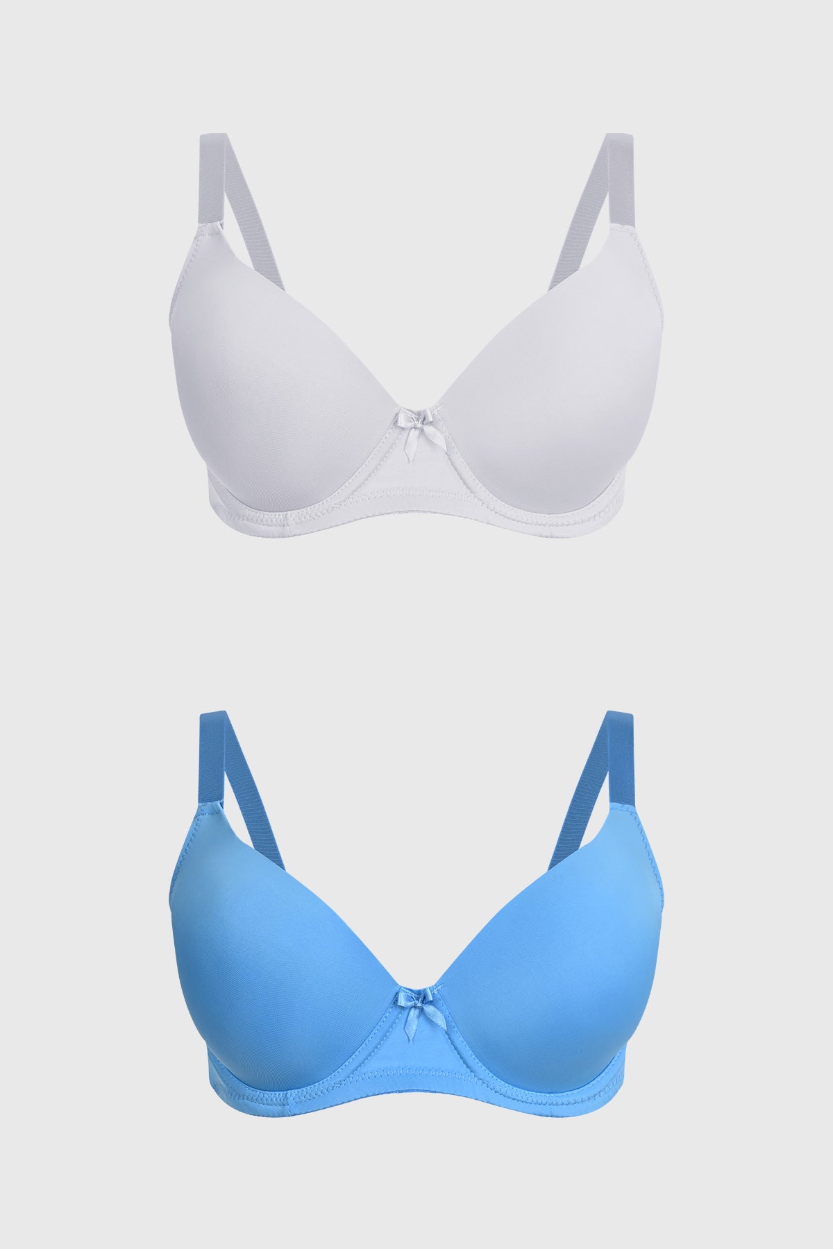 Bipack de sostenes mujer liso azul uno en blanco otro en azul con pequeño lazo central y tirantes ajustables