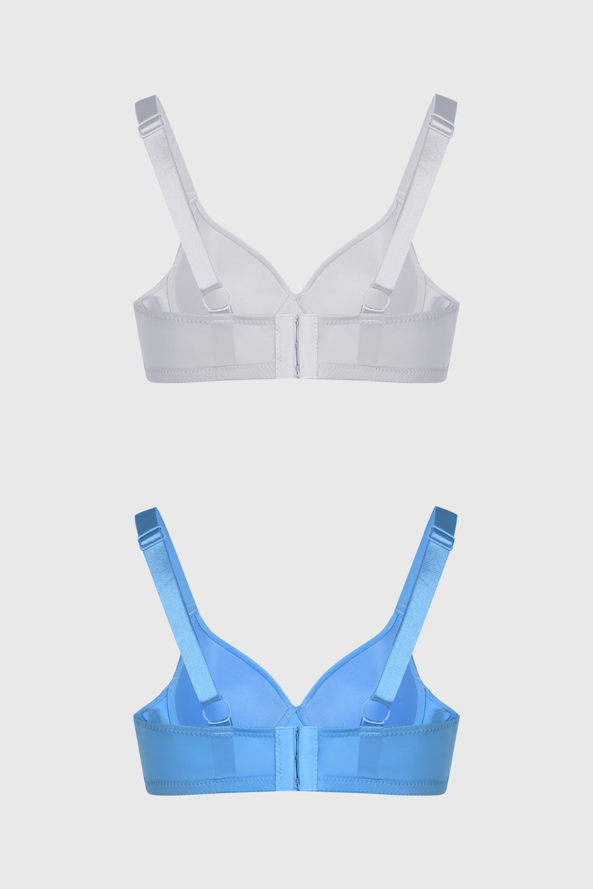 Bipack de sostenes mujer liso azul uno en blanco otro en azul con pequeño lazo central y tirantes ajustables