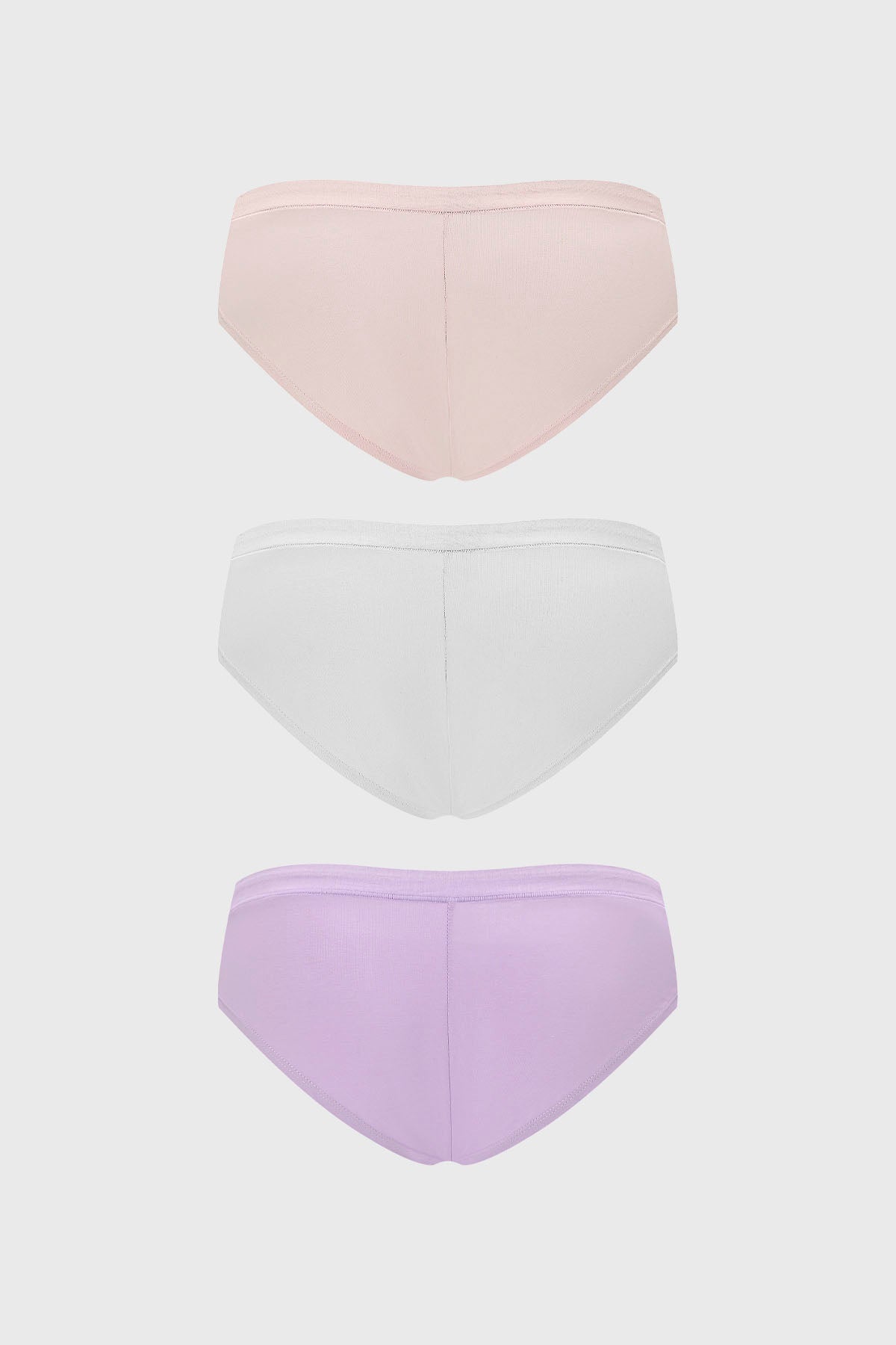 Tripack de pantaletas lisas en palo rosa blanco y lila con lazo pequeño en el centro diseño simple y elegante