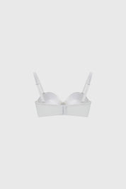 Sostén strapless blanco liso con copas suaves y banda ajustable ideal para usar bajo blusas sin tirantes