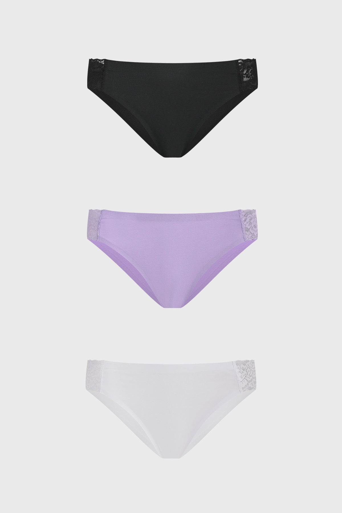 Calzón tripack mujer lila con detalle de encaje en costados colores negro lila y blanco diseño liso elegante