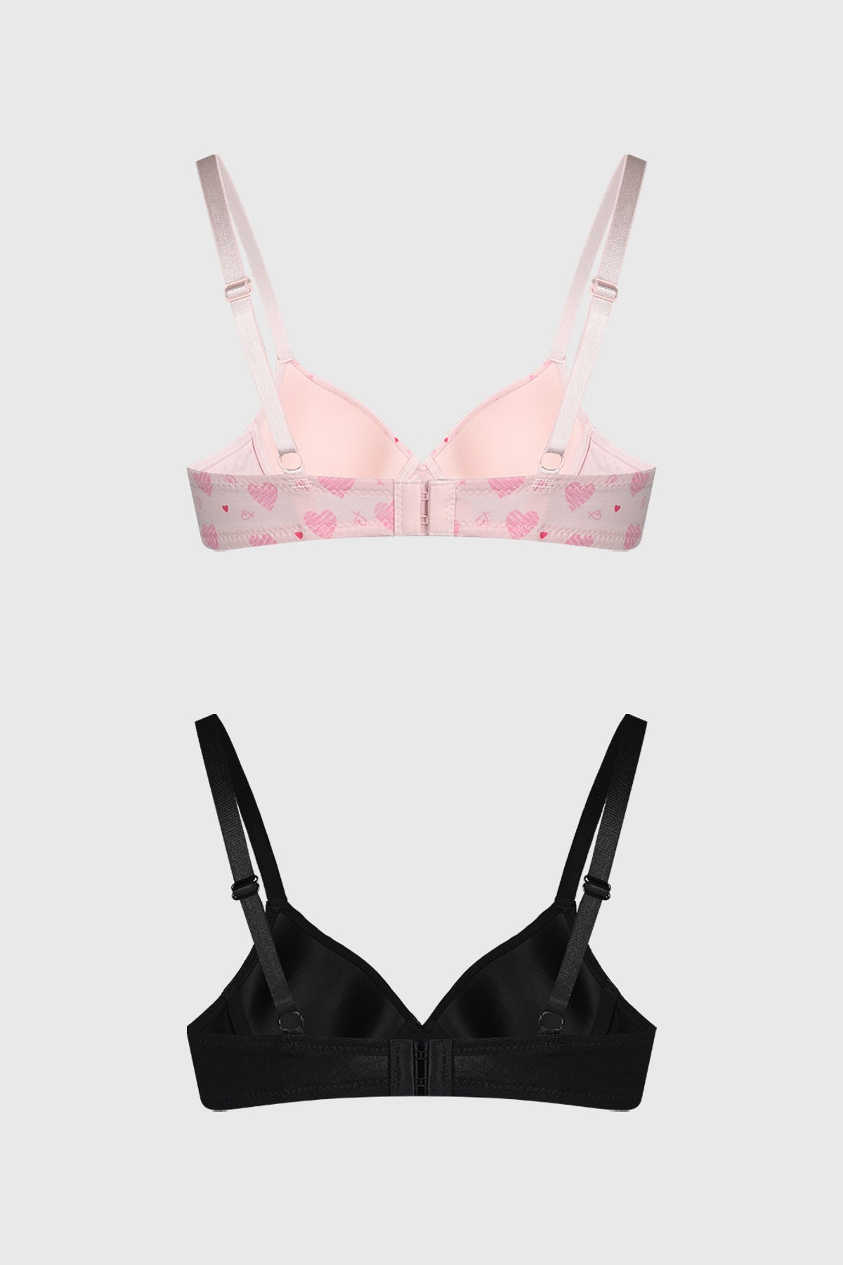 Bipack de sostenes mujer en palo rosa y negro uno con corazones rosados en estampado pequeño y otro liso ambos con tirantes ajustables