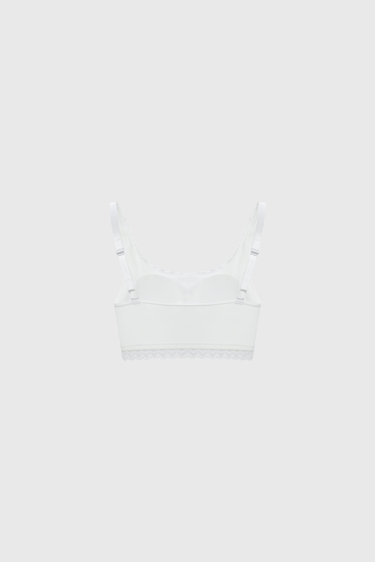 Sostén blanco de mujer con detalle de encaje en la parte inferior diseño liso y moderno sin estampas