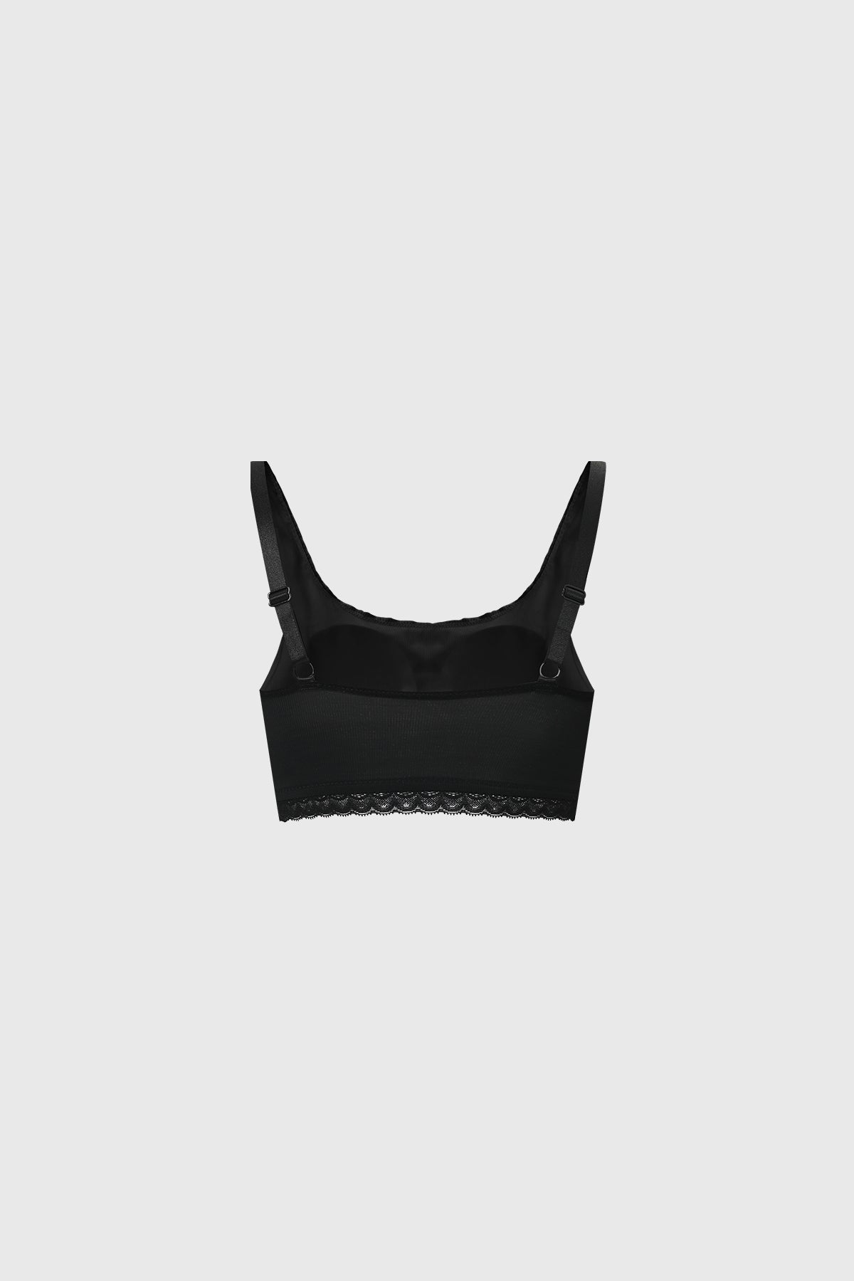 Sostén negro de mujer con detalle de encaje en el borde inferior sin estampa diseño elegante y minimalista