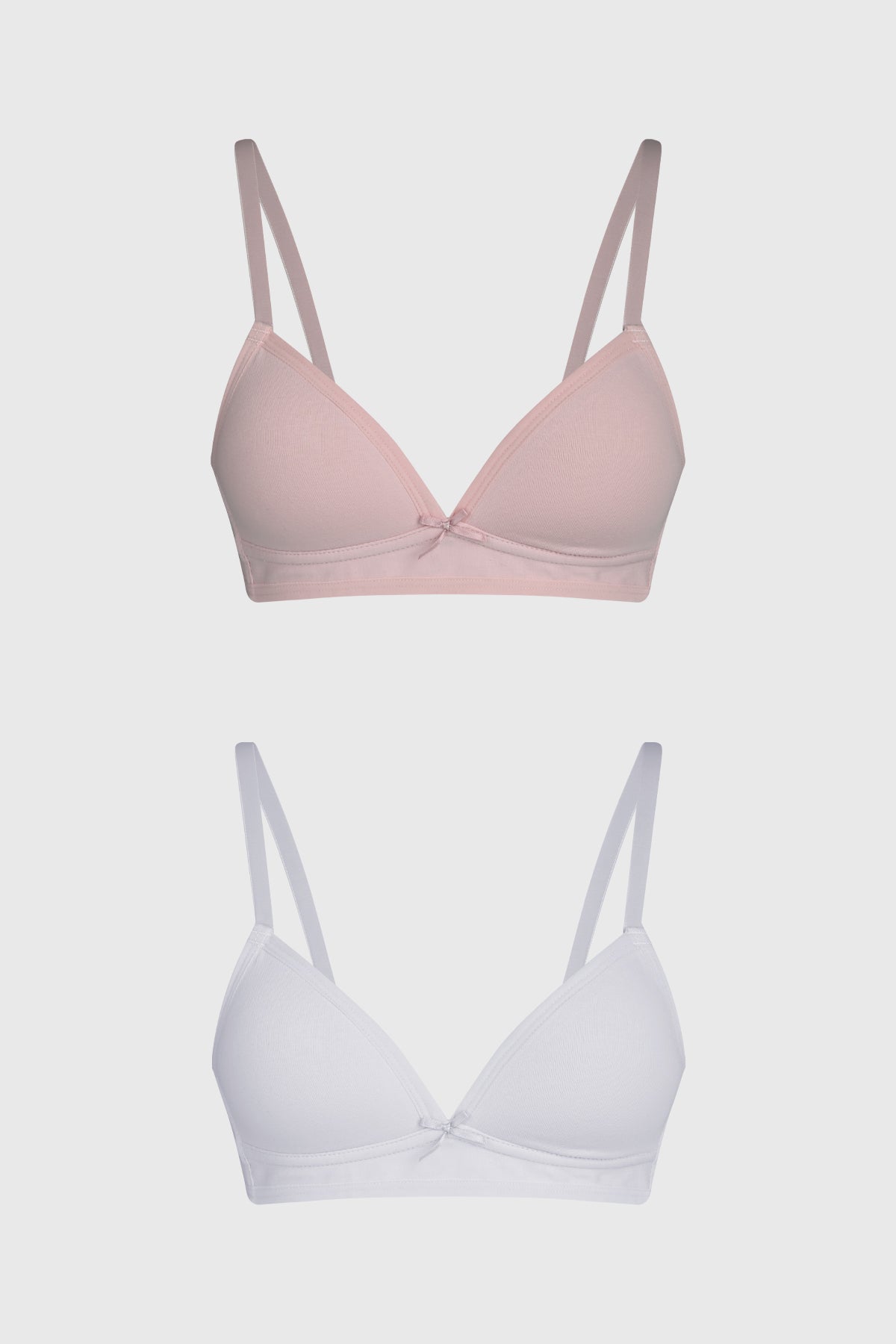 Sostén mujer palo rosa con tirantes delgados y pequeño lazo central diseño liso ideal para uso diario cómodo y suave