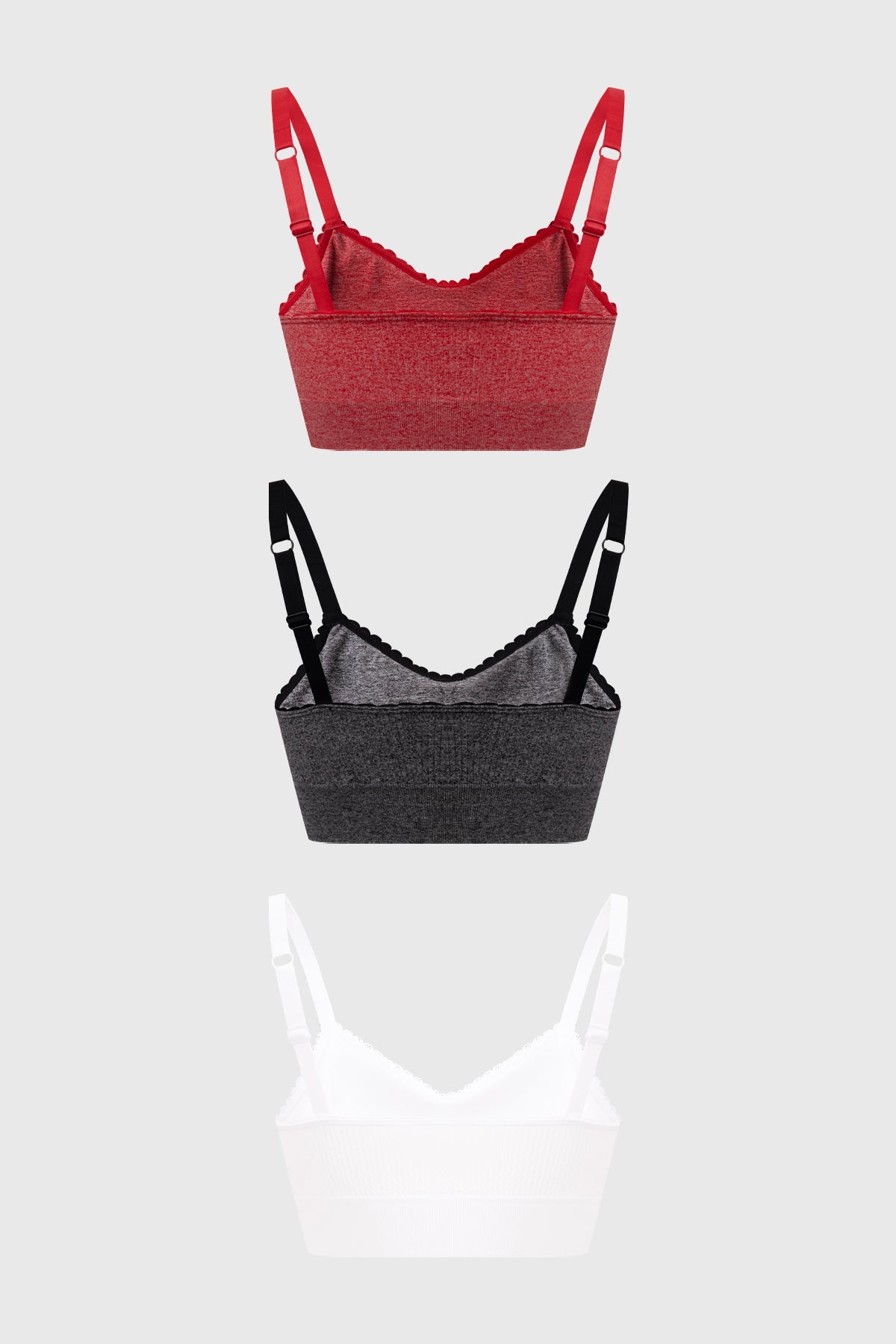 Tripack de sostenes juveniles en rojo negro y blanco con diseño recogido y detalles de encaje en la parte superior