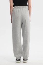 Pantalón jogger gris melange con ajuste en cintura y tobillos estampa lateral Glow Girl Forever en estilo casual relajado