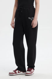 Pantalón jogger negro mujer con estampa pequeña Paris City Vintage en el muslo derecho estilo casual y cómodo