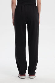 Pantalón jogger negro mujer con estampa pequeña Paris City Vintage en el muslo derecho estilo casual y cómodo