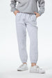 Pantalón buzo mujer jogger gris melange con cintura elástica y bolsillos