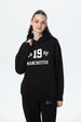 Polerón mujer oversize negro con estampado de texto blanco