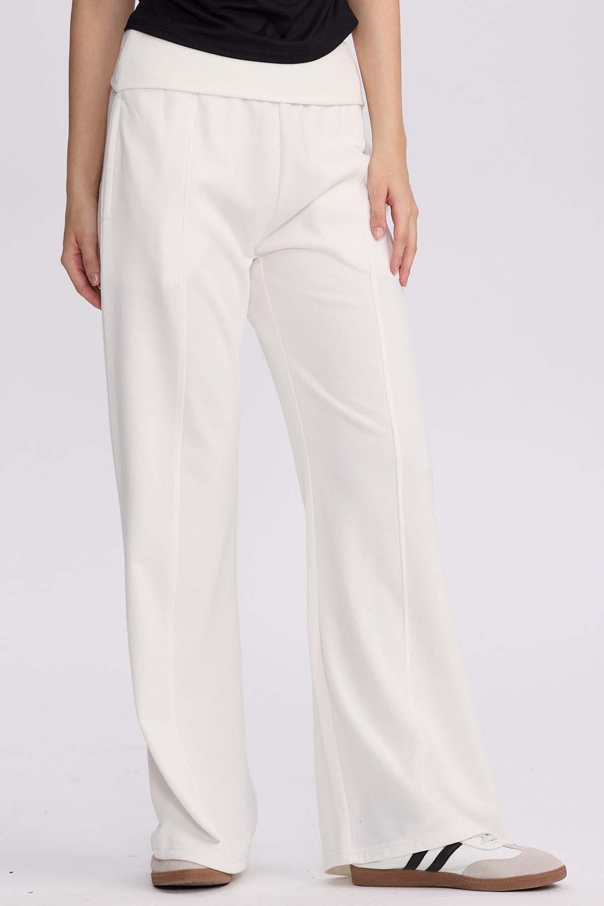 Pantalón buzo mujer pretina crema