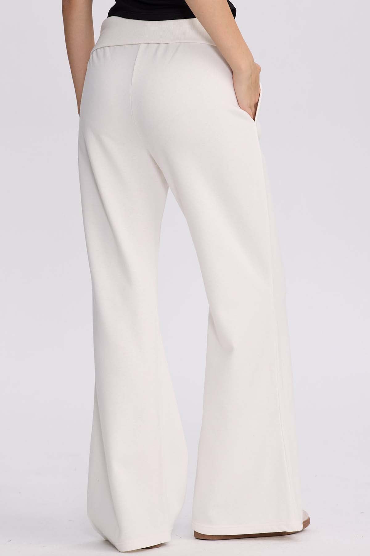 Pantalón buzo mujer pretina crema