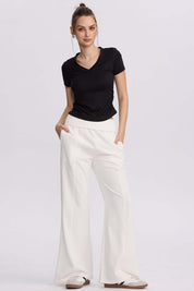 Pantalón buzo mujer pretina crema