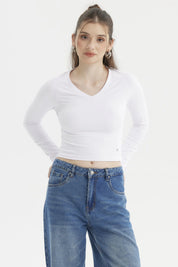 Polera mujer blanca lisa manga larga ajustada escote en V sin estampas
