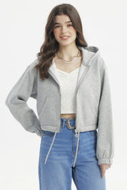 Polerón crop gris melange con cierre delantero y capucha lisa perfecto para un look casual y moderno