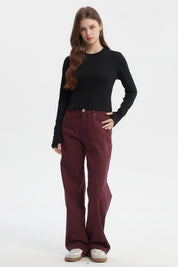 Polera negra de mujer manga larga con abertura en el puño diseño liso ideal para un look casual elegante