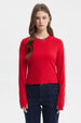 Polera mujer roja de manga larga con abertura en puños sin estampa lisa ideal para un look casual y moderno