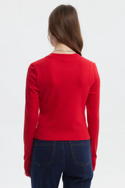 Polera mujer roja de manga larga con abertura en puños sin estampa lisa ideal para un look casual y moderno