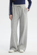 Pantalón buzo mujer gris melange estilo wide leg con cordón ajustable sin estampa visible diseño liso cómodo y moderno