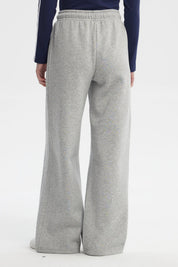 Pantalón buzo mujer gris melange estilo wide leg con cordón ajustable sin estampa visible diseño liso cómodo y moderno