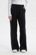Pantalón buzo negro de mujer tipo wide leg con líneas blancas laterales y cintura elástica sin estampa lisa