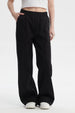 Pantalón buzo mujer negro con corte wide leg y cintura elástica prenda lisa ideal para un look casual y cómodo