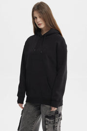 Polerón negro mujer con capucha y bolsillo canguro estampado Believe in Yourself en el pecho estilo casual urbano