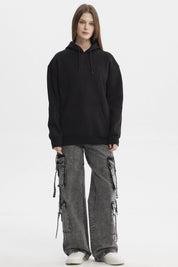 Polerón negro mujer con capucha y bolsillo canguro estampado Believe in Yourself en el pecho estilo casual urbano