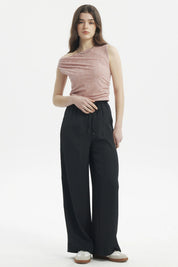 Pantalón holgado negro con cordón ajustable en la cintura diseño liso ideal para un look casual cómodo y moderno